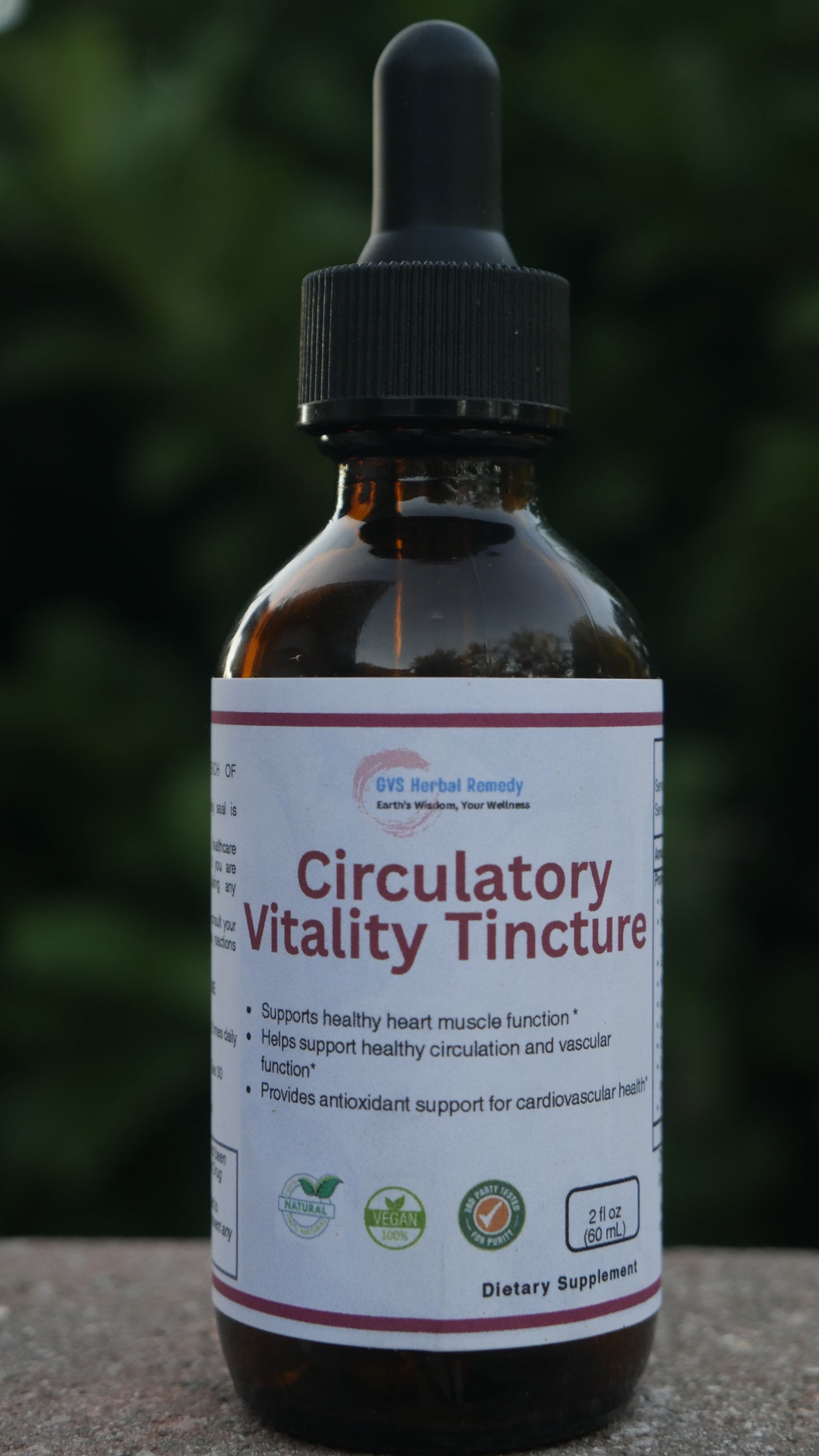 Bottle of 'Circulatory Vitality Tincture' with a blurred green background