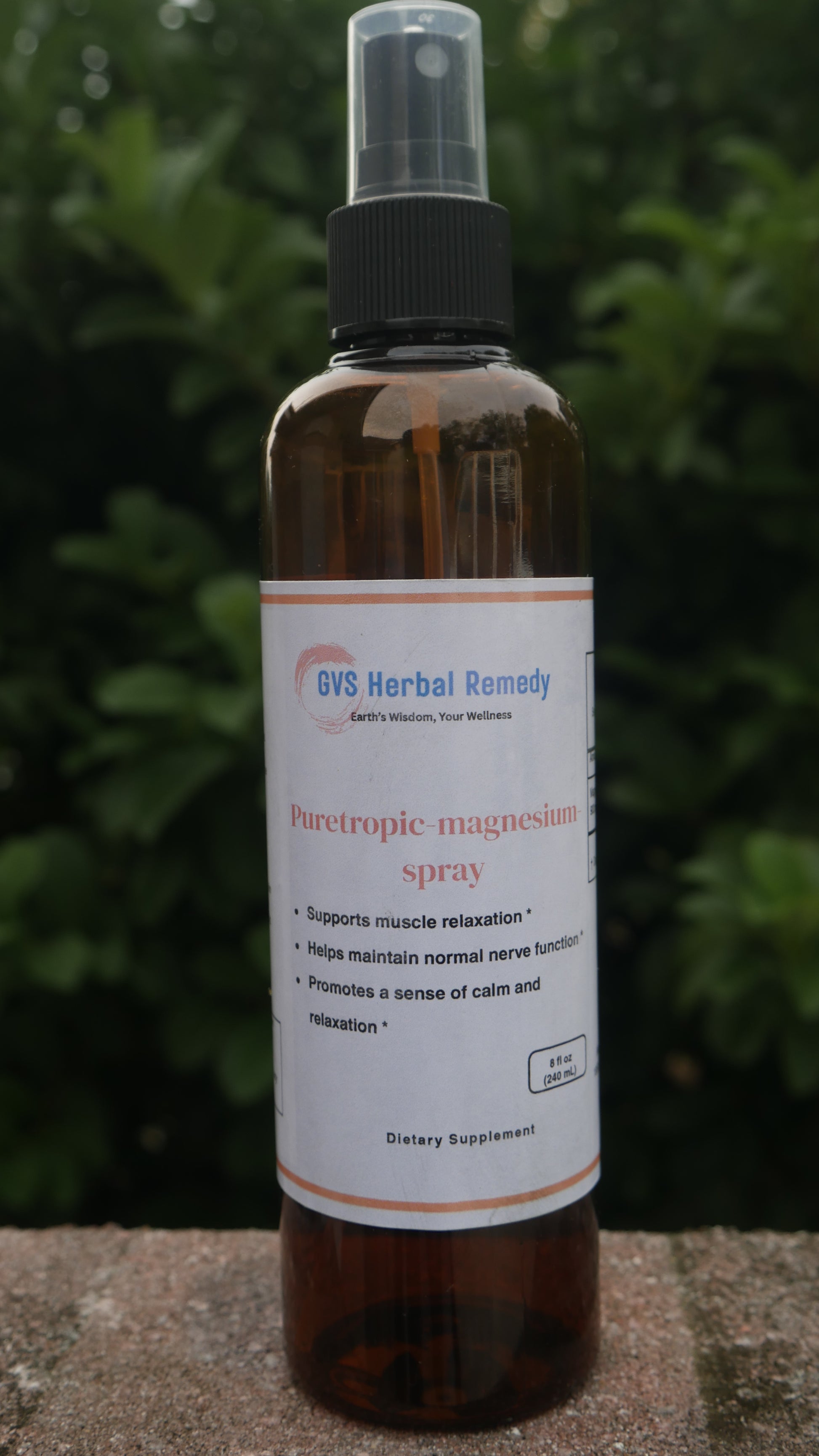 Bottle of herbal remedy spray with a label on a natural background